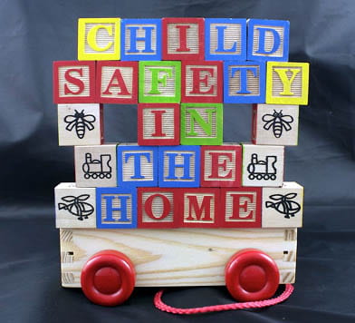 Colourful children's letter blocks that spells "CHILD SAFETY IN THE HOME"